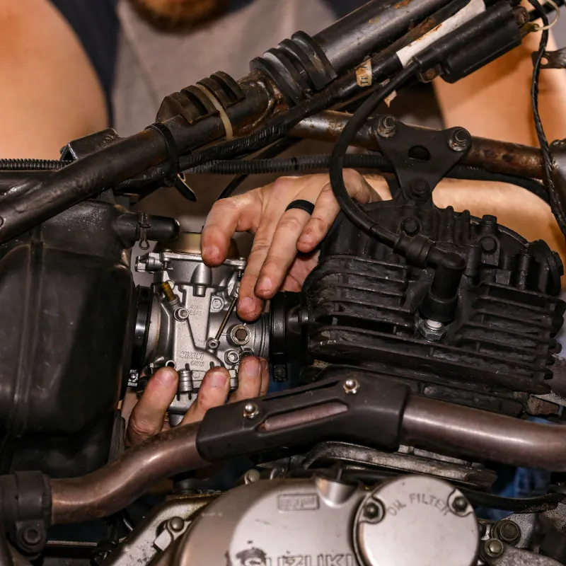 Technician performing carburetor and fuel system repair in Utah